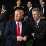 Scott Brown (right) spoke with Donald Trump during a campaign rally last month in New Hampshire. 