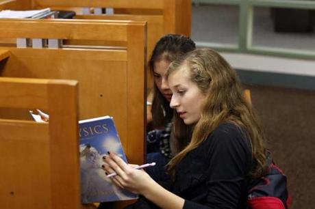 Julia Medoff, 17, (right) studied for the new SAT with Winnie McCabe, 16, at Dover-Sherborn High School on Wednesday.
