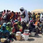 Internally displaced persons waited to be served with food at Dikwa Camp, in Borno state in north-eastern Nigeria last month.