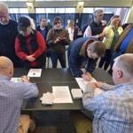 Voters sign in to receive their ballot to participate in the 2016 Republican Caucus, Saturday, March 5, 2016 in Bowling Green Ky. (AP Photo/Timothy D. Easley)