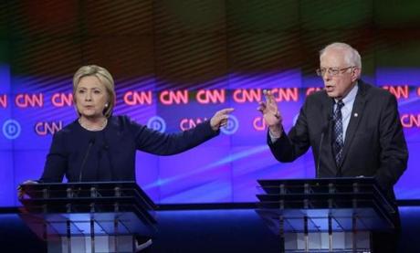 Hillary Clinton and Bernie Sanders during the Democratic presidential primary debate in Flint, Michigan, on Sunday.

