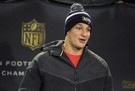 New England Patriots tight end Rob Gronkowski faces reporters before an NFL football practice, Thursday, Jan. 21, 2016, in Foxborough, Mass. The Patriots are to play the Denver Broncos in the AFC Championship on Sunday in Denver. (AP Photo/Steven Senne) 
