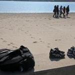 A group of students enjoyed a walk along the sands of Carson Beach in South Boston. 