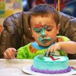 Andre DeCorzo Jr. concentrated on his ?smash cake? during his birthday party at the Children?s Museum of Fall River in October.