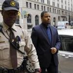 Baltimore police Officer William G. Porter (right) arrived for a court appearance in Baltimore in December. Maryland?s top court ruled Tuesday that prosecutors can force Porter to testsify against other officers in the Freddie Gray case.