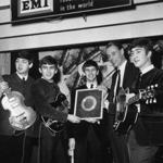 George Martin (second from right) with The Beatles in 1963.