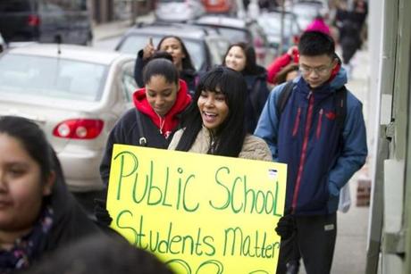 3/7/2016 - Charlestown, MA - Lorena Paulino, cq, (center with sign) a senior at Charlestown High School was among the dozens of Charlestown High School students who participated in a walk out on Monday morning, March 7, 2016 to protest public school funding cuts. Topic: 08bps. Story by Jan Ransom/Globe Staff. Photo by Dina Rudick/Globe Staff
