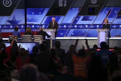 Sen. Bernie Sanders and Hillary Clinton during the Democratic presidential debate hosted by Univision and The Washington Post at Miami-Dade College in Miami, March 9, 2016. (Todd Heisler/The New York Times)
