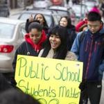 3/7/2016 - Charlestown, MA - Lorena Paulino, cq, (center with sign) a senior at Charlestown High School was among the dozens of Charlestown High School students who participated in a walk out on Monday morning, March 7, 2016 to protest public school funding cuts. Topic: 08bps. Story by Jan Ransom/Globe Staff. Photo by Dina Rudick/Globe Staff