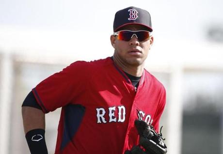 Boston Red Sox' Yoan Moncada practices during spring training, Friday, March 13, 2015, in Fort Myers Fla. The Red Sox have finalized a minor league contract with the 19-year-old Cuban infielder that includes a $31.5 million signing bonus, easily a record for an international amateur free agent under 23 years old. (AP Photo/Brynn Anderson) 
