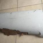 A piece of debris found by a South African family off the Mozambique coast in December 2015, which authorities will examine to see if it is from missing Malaysia Airlines flight MH370, is pictured in this handout photo released to Reuters March 11, 2016. REUTERS/Candace Lotter/Handout via Reuters ATTENTION EDITORS - THIS PICTURE WAS PROVIDED BY A THIRD PARTY. REUTERS IS UNABLE TO INDEPENDENTLY VERIFY THE AUTHENTICITY, CONTENT, LOCATION OR DATE OF THIS IMAGE. FOR EDITORIAL USE ONLY. NOT FOR SALE FOR MARKETING OR ADVERTISING CAMPAIGNS. NO RESALES. NO ARCHIVE. THIS PICTURE IS DISTRIBUTED EXACTLY AS RECEIVED BY REUTERS, AS A SERVICE TO CLIENTS. MUST ON SCREEN COURTESY CANDACE LOTTER. MANDATORY CREDIT