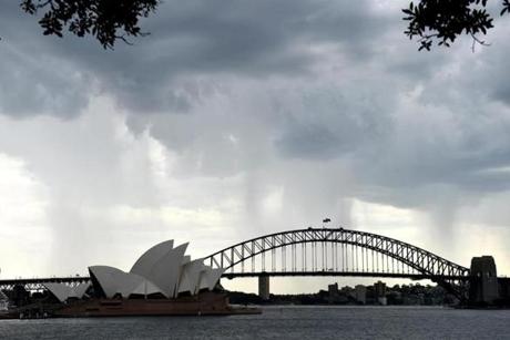 Heavy rain approached the famed Sydney Opera House.
