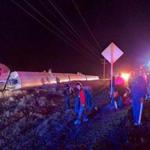 Passengers gathered Monday after an Amtrak train derailed near Dodge City, Kan.