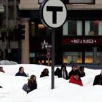 Pedestrians were obscured by snow banks in downtown Boston last year.