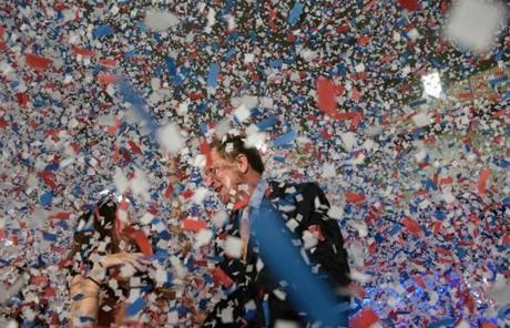 John Kasich was obscured by confetti at his election night party. SMIALOWSKI/AFP/Getty Images
