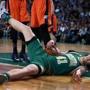 03/16/16: Boston, MA: The Celtics Kelly Olynyk was back in action tonight, here he hits the floor hard after being fouled on a first quarter drive to the basket. The Boston Celtics hosted the Oklahoma City Thunder in a regular season NBA basketball game at the TD Garden. (Globe Staff Photo/Jim Davis) section:sports topic:celtics-thunder