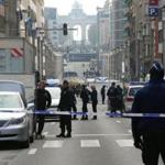 Policemen stand guard near a security perimeter set in the Rue de la Loi near the Maalbeek subway station, in Brussels, on March 22, 2016, after an explosion killed around 10 people, according to spokesman of Brussels' fire brigade A string of explosions rocked Brussels airport and a city metro station on Tuesday, killing at least 13 people, according to media reports, as Belgium raised its terror threat to the maximum level. / AFP PHOTO / Belga / NICOLAS MAETERLINCK / Belgium OUTNICOLAS MAETERLINCK/AFP/Getty Images