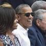 epa05226326 US President Barack Obama (C), First Lady Michelle Obama (L) and President of Cuba Raul Castro (R) attend a Major League Baseball exhibition game between the Tampa Bay Rays and the Cuban national team at the Estadio Latinoamericano (Latin American Stadium) in Havana, Cuba, 22 March 2016. Obama is on an official visit to Cuba from 20 to 22 March 2016, the first sitting US president to visit since Calvin Coolidge 88 years ago. EPA/MICHAEL REYNOLDS