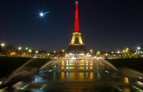 The Eiffel Tower was seen with the black, yellow and red colors of the Belgian flag in Paris. 
