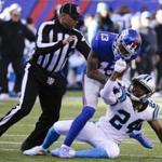 FILE - In this Dec. 20, 2015, file photo, a referee, left, separates New York Giants wide receiver Odell Beckham (13) and Carolina Panthers' Josh Norman (24) during the first half of an NFL football game Sunday, Dec. 20, 2015, in East Rutherford, N.J. The NFL's powerful competition committee is recommending making extra point kicks from the 15-yard line permanent, eliminating all chop blocks and ejecting a player for twice receiving certain unsportsmanlike conduct penalties. (AP Photo/Julie Jacobson, File)