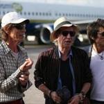 Mick Jagger, Keith Richards, and Ronnie Wood of the Rolling Stones spoke to media after their plane landed in Havana Thursday. 