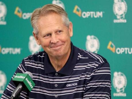 Danny Ainge, president of basketball operations, smiles as he listens to a question during the team's NBA basketball media day at their training facility in Waltham, Mass., Friday, Sept. 25, 2015. (AP Photo/Mary Schwalm)
