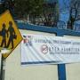 In this March 15, 2016 photo, a sign hangs at a Catholic primary school with the message in Spanish: 