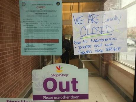 Signs on the Stop & Shop front door advised customers that the store was temporarily closed.
