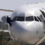 A man climbed out of a cockpit window of an EgyptAir plane that had been hijacked Tuesday and diverted to Cyprus.