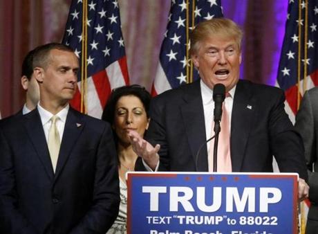 Trump campaign manager Corey Lewandowski (left) took the stage with Donald Trump at an election night event in Florida earlier this month.
