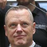 Governor Charlie Baker had his head shaved for charity at Granite Communications in Quincy.