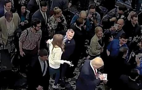Michelle Fields, Corey Lewandowski, and Donald Trump are highlighted for emphasis in this March 8 image.
