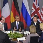 US President Barack Obama(C) flanked by China's President Xi Jinping (R) and France's President Francois Hollande take part in a P5+1 meeting during the Nuclear Security Summit at the Walter E. Washington Convention Center on Apri1 1, 2016 in Washington, DC. At right is European Council President Donald Tusk. / AFP PHOTO / MANDEL NGANMANDEL NGAN/AFP/Getty Images