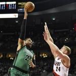 Mar 31, 2016; Portland, OR, USA; Boston Celtics center Jared Sullinger (7) shoots the ball over Portland Trail Blazers center Mason Plumlee (24) during the first quarter at the Moda Center at the Rose Quarter. Mandatory Credit: Steve Dykes-USA TODAY Sports