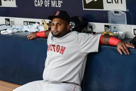 Boston Red Sox third baseman Pablo Sandoval (48) sits on the bench before the start of a baseball game against the Atlanta Braves Thursday, June 18, 2015, in Atlanta. Boston third baseman Pablo Sandoval has been benched by manager John Farrell after using his Instagram account during a loss to the Braves on Wednesday. (AP Photo/Jon Barash)
