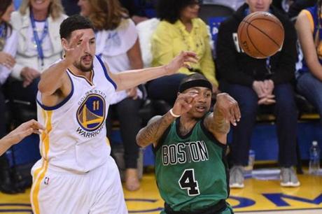 April 1, 2016; Oakland, CA, USA; Boston Celtics guard Isaiah Thomas (4) passes the basketball against Golden State Warriors guard Klay Thompson (11) during the second quarter at Oracle Arena. Mandatory Credit: Kyle Terada-USA TODAY Sports

