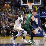 Jonas Jerebko of the Boston Celtics tried to steal the ball from Draymond Green of the Golden State Warriors at Oracle Arena on Friday in Oakland, Calif.
