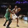Playing his final game against the Celtics, Kobe Bryant looked for room to maneuver against Jae Crowder.