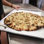 11/15/2015 Chestnut Hill Frank Pepe has opened a new location in Chestnut Hill . A white clam pizza just ot of the oven. Globe/Staff Photographer Jonathan Wiggs
