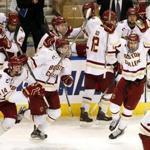 Boston College players come off the bench to celebrate beating Minnesota-Duluth 3-2 during their NCAA tournament hockey game in Worcester, Mass. Saturday, March 26, 2016. (Winslow Townson for The Boston Globe)