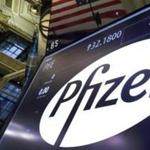The Pfizer logo appears above a trading post on the floor of the New York Stock Exchange, Monday, Nov. 23, 2015. Pfizer and Allergan are joining in the biggest buyout of the year, a $160 billion stock deal that will create the world's largest drugmaker. (AP Photo/Richard Drew)