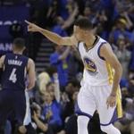 Golden State Warriors' Stephen Curry (30) celebrates after scoring against the Memphis Grizzlies during the first half of an NBA basketball game Wednesday, April 13, 2016, in Oakland, Calif. (AP Photo/Marcio Jose Sanchez)