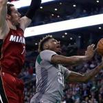 Boston, MA - 04/13/16 - (1st quarter) Boston Celtics guard Marcus Smart (36) puts up a shot as he is defended by Miami Heat guard Goran Dragic (7) during the first quarter. The Boston Celtics take on the Miami Heat at TD Garden in the last home game of the regular season. - (Barry Chin/Globe Staff), Section: Sports, Reporter: Adam Himmelsbach, Topic: 14Celtics-Heat, LOID: 8.2.2608382143. 