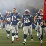 New England Patriots quarterback Tom Brady leads his team onto the field before before an NFL football game against the Pittsburgh Steelers Thursday, Sept. 10, 2015, in Foxborough, Mass. (AP Photo/Winslow Townson)