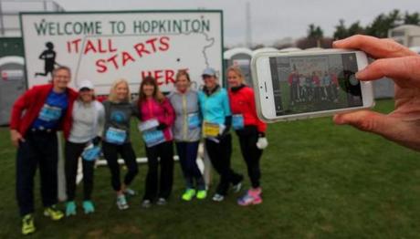 Hopkinton, MA - 04/20/15 - A group from Wayzata, Minnesota takes a souvenir picture in the Athlete's Village at the start in Hopkinton before the 2015 Boston Marathon. Lane Turner/Globe Staff Section: SPORTS Reporter: various Slug: race coverage

