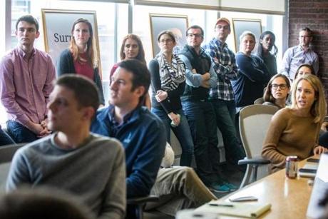 04/11/2016 BOSTON Employees watched a slideshow during an office meeting at HourlyNerd (cq) in Boston. (Aram Boghosian for The Boston Globe) 
