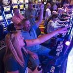 Charlie Robinson and Judy Nunn celebrated Robinson winning at the slot machines in the Plainridge Park Casino.