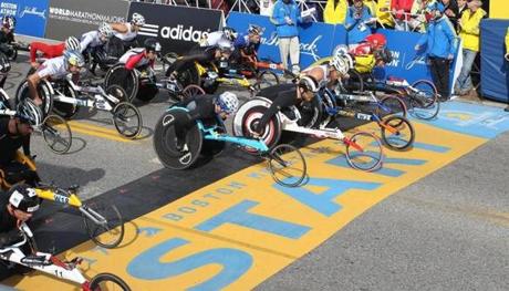 Defending champion Joshua Cassidy, of Canada, fifth front right, starts the wheelchair division of the 117th running of the Boston Marathon, in Hopkinton, Mass., Monday, April 15, 2013. (AP Photo/Stew Milne)
