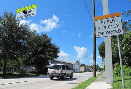 In this Aug. 29, 2014 photo, drivers enter the town of Waldo, Fla., where motorists can encounter many different speed limits in a roughly two-mile drive. The AAA auto club named the tiny town between Jacksonville and Gainesville one of only two ?traffic traps? nationwide. The other town is nearby Lawtey. Now Waldo is facing a scandal over its traffic tickets. (AP Photo/Jason Dearen)
