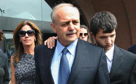 Boston, Mass--090911--Sal DiMasi leaves the Moakley Federal Court after his sentencing. He was given 8 years to serve at Devens. His wife Debbie(left) and his stepson Christian(rt) arm around him. .Boston Globe staff photo by John Tlumacki (metro)
